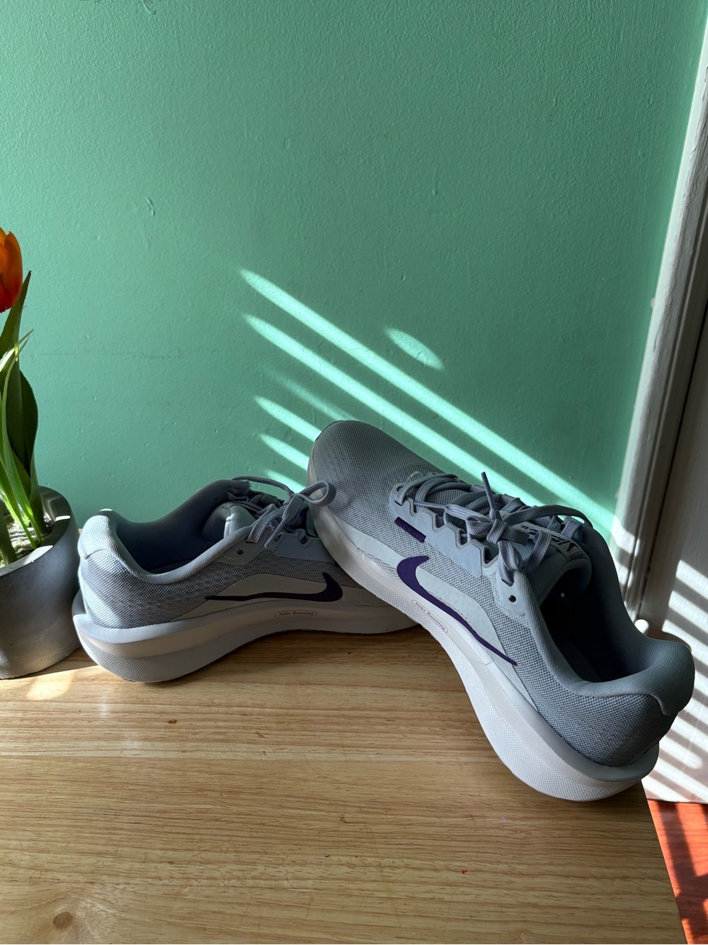 Nike Light Blue Sneakers with Dark Blue Nike Symbol